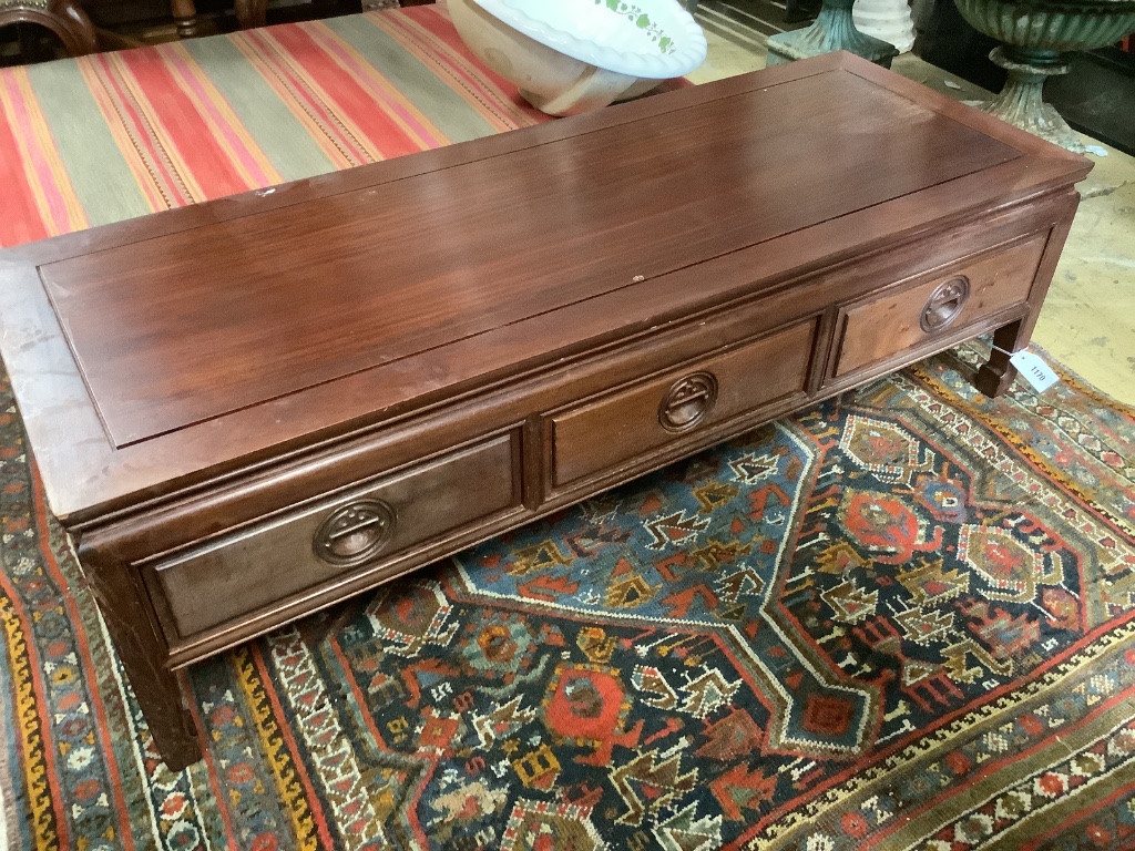 A Chinese hardwood rectangular three drawer coffee table, width 136cm, depth 51cm, height 40cm